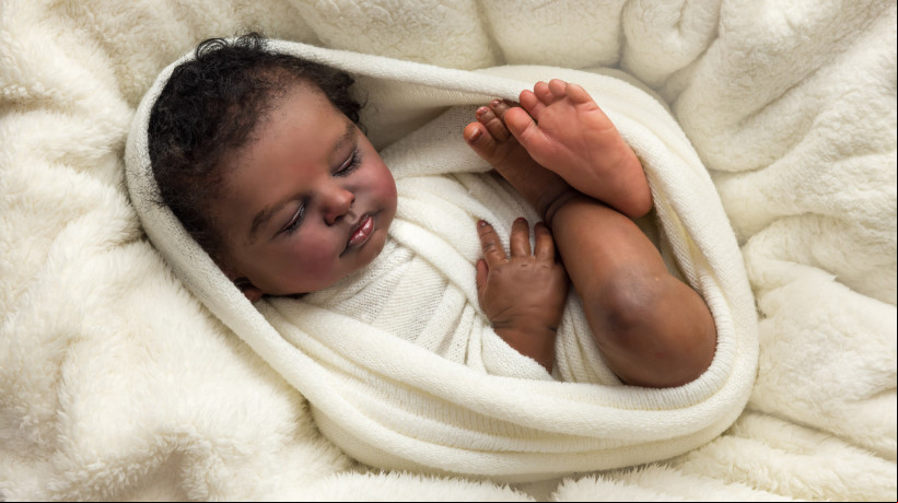 African reborn doll wrapped in white